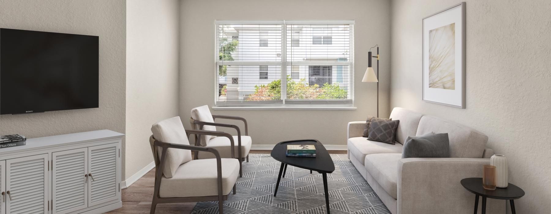 a living room with a tv and couches